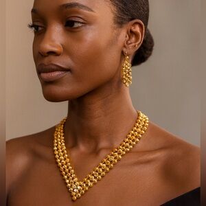 Gold Tone beaded V-shaped necklace and matching drop earrings set